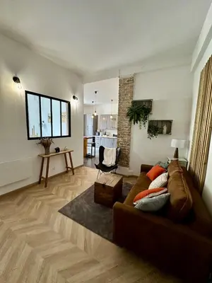 Coin salon dans l'établissement Appartement cozy & Spa