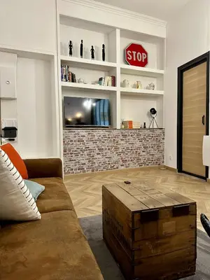 Coin salon dans l'établissement Appartement cozy & Spa