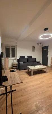 Coin salon dans l'établissement Ema centre-ville T2 rénové cocon cosy parking 34m2