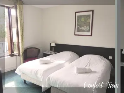 Un ou plusieurs lits dans un hébergement de l'établissement Logis Le Relais Champenois