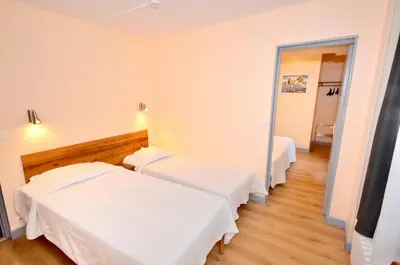 Un ou plusieurs lits dans un hébergement de l'établissement Hôtel de l'Ours
