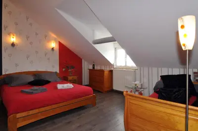 Un ou plusieurs lits dans un hébergement de l'établissement Gite de la Loge