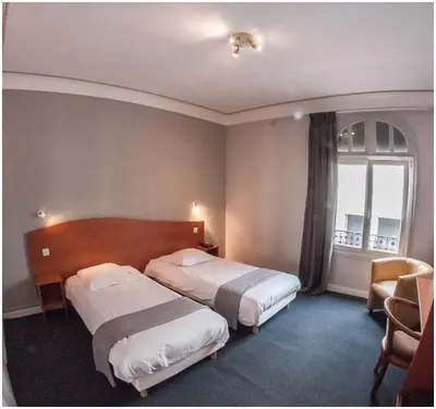 Un ou plusieurs lits dans un hébergement de l'établissement Hôtel Gambetta