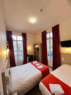 Un ou plusieurs lits dans un hébergement de l'établissement Hôtel De La Cathédrale