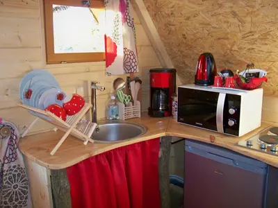 Cuisine ou kitchenette dans l'établissement Le Coeur De La Foret