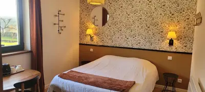 Un ou plusieurs lits dans un hébergement de l'établissement B&B CHEZ FOUCHS - Chambre d'hôtes