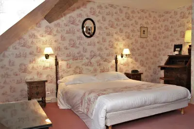 Un ou plusieurs lits dans un hébergement de l'établissement Hôtel Le Régent