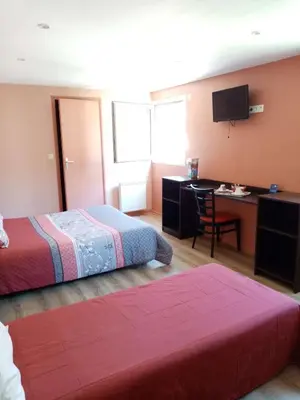 Un ou plusieurs lits dans un hébergement de l'établissement Brit Hotel St-Quentin/Nord