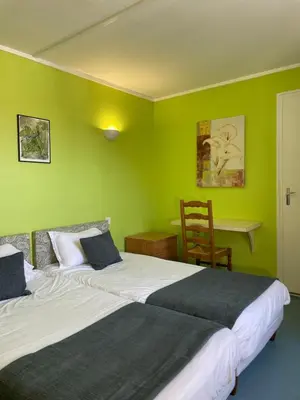 Un ou plusieurs lits dans un hébergement de l'établissement Auberge De L'Omois