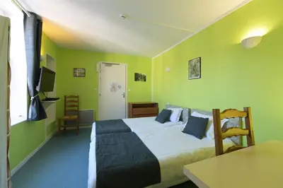 Un ou plusieurs lits dans un hébergement de l'établissement Auberge De L'Omois