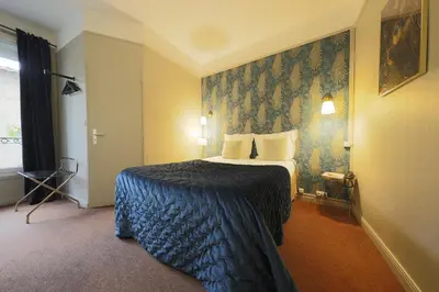 Un ou plusieurs lits dans un hébergement de l'établissement Hôtel Azur Reims Centre