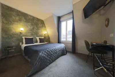 Un ou plusieurs lits dans un hébergement de l'établissement Hôtel Azur Reims Centre