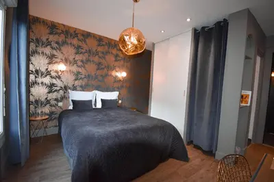 Un ou plusieurs lits dans un hébergement de l'établissement Hôtel Azur Reims Centre
