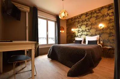 Un ou plusieurs lits dans un hébergement de l'établissement Hôtel Azur Reims Centre
