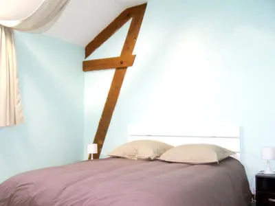 Un ou plusieurs lits dans un hébergement de l'établissement Maison accueillante près de Monthenault, parfaite pour groupes