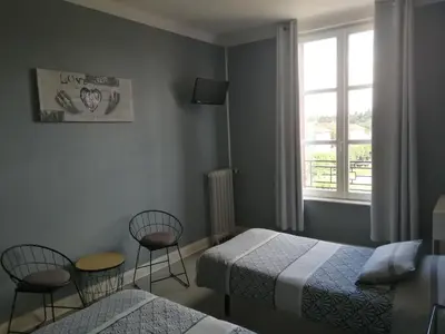 Un ou plusieurs lits dans un hébergement de l'établissement Hotel du Grand Monarque