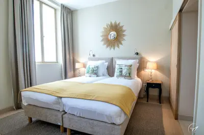Un ou plusieurs lits dans un hébergement de l'établissement Les Suites du Champagne de Venoge