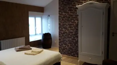 Un ou plusieurs lits dans un hébergement de l'établissement Chambre d'Hotes de la Loge