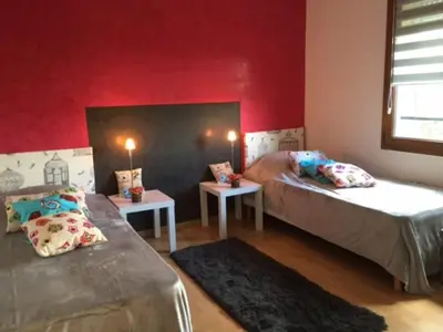 Un ou plusieurs lits dans un hébergement de l'établissement La Loge Du Vigneron