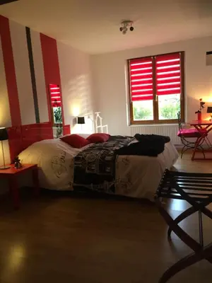 Un ou plusieurs lits dans un hébergement de l'établissement La Loge Du Vigneron