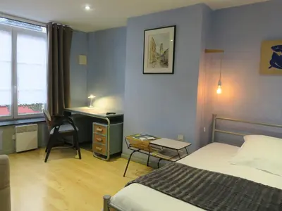 Un ou plusieurs lits dans un hébergement de l'établissement Chambres du Petit Bois