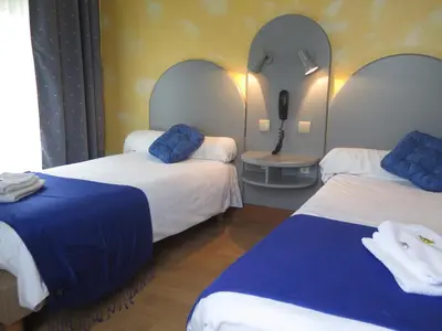 Un ou plusieurs lits dans un hébergement de l'établissement Auberge Champenoise
