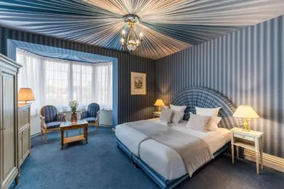 Un ou plusieurs lits dans un hébergement de l'établissement Grand Hôtel Des Templiers