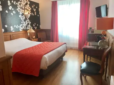 Un ou plusieurs lits dans un hébergement de l'établissement Hotel d'Angleterre