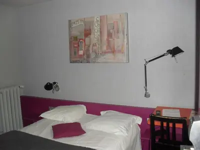 Un ou plusieurs lits dans un hébergement de l'établissement Hôtel Latino Reims Centre