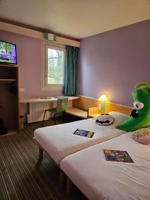 Télévision ou salle de divertissement dans l'établissement Hotel Bonanite