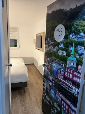 Un ou plusieurs lits dans un hébergement de l'établissement Kyriad Direct Reims