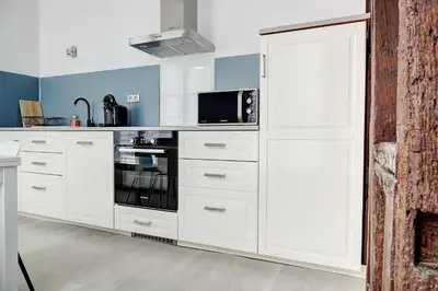 Cuisine ou kitchenette dans l'établissement Le République