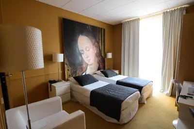 Un ou plusieurs lits dans un hébergement de l'établissement Hôtel Cecyl Reims Centre