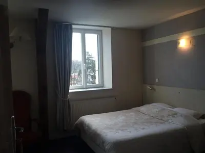 Un ou plusieurs lits dans un hébergement de l'établissement Hôtel De Paris