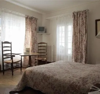 Un ou plusieurs lits dans un hébergement de l'établissement Auberge De L'abbaye