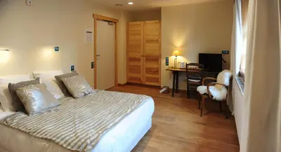 Un ou plusieurs lits dans un hébergement de l'établissement Auberge De L'abbaye