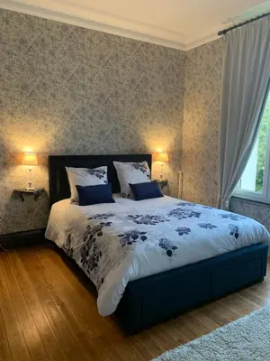 Un ou plusieurs lits dans un hébergement de l'établissement L'hostellerie du chateau