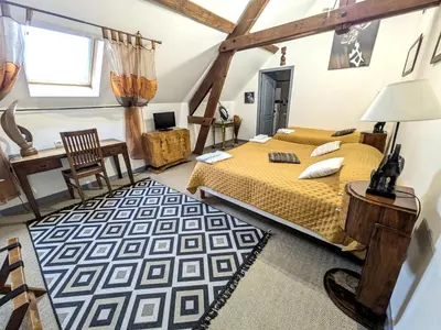Un ou plusieurs lits dans un hébergement de l'établissement Chateau de Quesmy