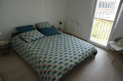 Un ou plusieurs lits dans un hébergement de l'établissement Appartement Forum Reims