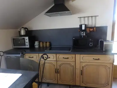 Cuisine ou kitchenette dans l'établissement Gite Au Grenier Cosy
