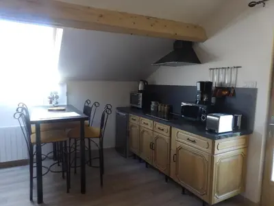 Cuisine ou kitchenette dans l'établissement Gite Au Grenier Cosy