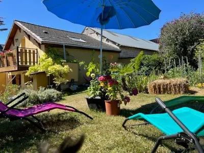 Jardin de l'établissement Gite Au Grenier Cosy