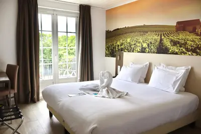 Un ou plusieurs lits dans un hébergement de l'établissement Best Western Hotel Restaurant Ile de France