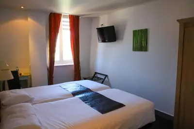 Un ou plusieurs lits dans un hébergement de l'établissement Hotel Aux Sacres Reims, Centre Historique