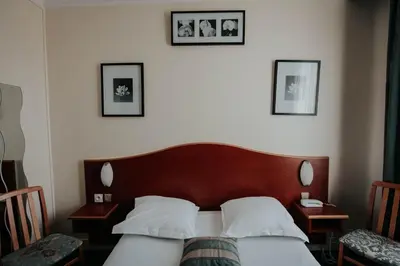 Un ou plusieurs lits dans un hébergement de l'établissement Hôtel Crystal Reims Centre