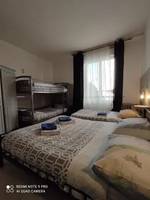 Un ou plusieurs lits dans un hébergement de l'établissement Hotel Le Bon Moine