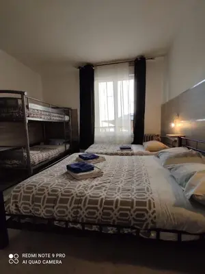 Un ou plusieurs lits dans un hébergement de l'établissement Hotel Le Bon Moine