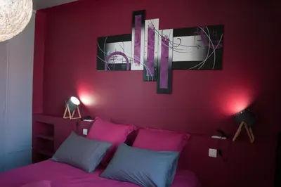 Un ou plusieurs lits dans un hébergement de l'établissement L'Iliade - Chambres d'hôtes - B&B à Bouzy