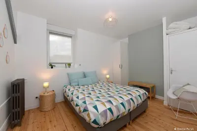 Un ou plusieurs lits dans un hébergement de l'établissement Chambres d'hotes Les Nuits Pastel