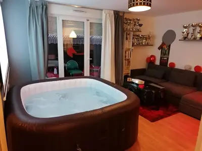 Coin salon dans l'établissement Joli Appartement Coquet